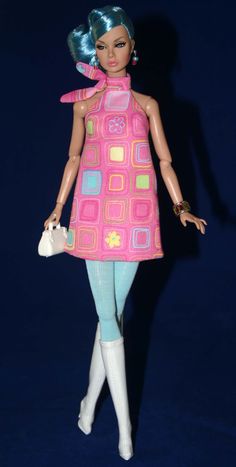 a barbie doll with blue hair wearing a pink dress and holding a white handbag