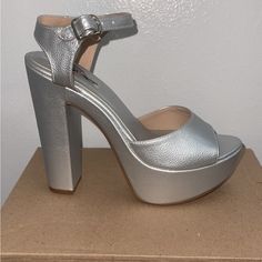 Gorgeous Silver Heels. They Are Very Comfortable And Can Be Worn For Any Ocasin. Comes With Stick On The Heel Never Have Worn Them Only Tried On When I Bought Themselves They Are A Size 6.5 Silver High Heel Block Heels With Stacked Heel, Silver High Block Heels With Stacked Heel, Party Block Heels With Platform, Medium Width, Party Block Heels With Platform In Medium Width, Party Block Heels With Platform And Medium Width, Silver Block Heels With Stacked High Heel, Silver Synthetic Platform Heels, Silver Platform Heels In Synthetic Material, Party Heels With Ankle Strap And Deep Heel Cup