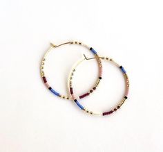 Large, hand-beaded boho-style hoop earrings. Very light weight.  4 beautiful color combinations to choose from. Made with very high quality Japanese beads. Gold plated, 1.5 inch hoops.  🌎 Packaging 🌎 To be environmentally responsible about packaging we will package orders together in the same box. If certain items in your order are intended as gifts and you'd like individual boxes, please leave a note during checkout. To view more items from this shop, click the link below:  https://www.etsy.c Hoop Beaded Earrings, Beaded Earrings Native American, Package Orders, Seed Bead Hoop Earrings, Bead Hoop Earrings, Hoop Earrings Large, Earrings Native American, Beaded Earrings Native, Japanese Beads