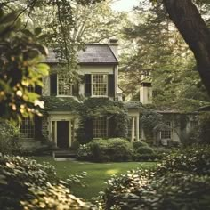 an old house with ivy growing all over it