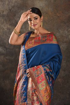 Exquisite blue Kani silk saree is one of a kind drape for a saree wardrobe! It comes with a matching blouse piece. Shop designer sarees in USA from Pure Elegance. Disclaimer: The shown stitched blouse on the model is for display purpose only. The saree comes with a matching blouse piece and finished with fall and piko. The actual product may vary slightly from the image. These are custom orders, hence expect slight variation in color, placement of the motif or buta. ESTIMATED DELIVERYBecause this is a custom order, it would take about 4 weeks from the date of purchase. RETURN POLICYThis product is a custom order and cannot be returned or exchanged. Festive Blue Tussar Silk Pre-draped Saree, Blue Tussar Silk Pre-draped Saree With Dupatta, Festive Blue Art Silk Pre-draped Saree, Blue Silk Pre-draped Saree In Traditional Style, Blue Katan Silk Pre-draped Saree With Zari Work, Blue Pre-draped Saree With Zari Weaving, Traditional Blue Pre-draped Saree With Dupatta, Blue Pre-draped Saree With Unstitched Blouse For Festivals, Blue Bollywood Banarasi Silk Pre-draped Saree