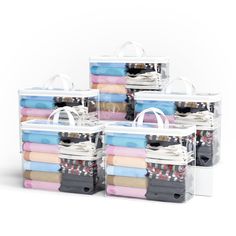 six clear storage bags with clothes in them on top of each other and one holding a white bag