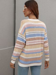 Our Quellise Top comes in a baby pink tone base with a multicoloured stripe pattern. It features a crew neckline and a long straight sleeves for a relaxed, comfortable fit. This cute knit is perfect for layering during the fall months ahead! Size Guide: Tina is 5’2” tall, and has a 33.2” bust, 24.5”waist, & 36.7” hips. She is wearing a S / US 4 / AU 8. This knit top is true to size. Feature: Crochet net detail, Relaxed fit, Stripe print, Maternity friendly. Material: 100% acrylic Care Instructio Spring Horizontal Stripe Long Sleeve Sweater, Casual Striped Color Block Sweater, Striped Sweater For Spring Layering, Casual Striped Long Sleeve Sweater, Casual Long Sleeve Striped Sweater, Spring Sweater With Horizontal Stripe Pattern, Casual Multicolor Sweater With Ribbed Cuffs, Multicolor Knit Tops With Ribbed Cuffs, Striped Crew Neck Sweater For Spring