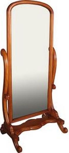 a mirror sitting on top of a wooden stand