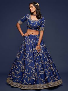 This Royal Blue Silk Lehenga Choli Set is the perfect addition to your closet.This set is crafted on soft and flowy art silk material. The choli comes with 3/4th sleeves with a stunning border on the sleeves and neckline. The lehenga is adorned with embellished detailing, sequins work, dori and tassels. The lehenga comes with can-can. This set comes with a stunning net dupatta that is both light-weight and elegant. Fabric- Art Silk 3/4th sleeves Round Neck Lehenga length: 42 inches Embroidery- Z Festive Indigo Dupatta For Wedding, Wedding Indigo Sets With Dupatta, Indigo Wedding Sets With Dupatta, Indigo Wedding Set With Dupatta, Indigo Traditional Wear For Wedding With Cutdana Details, Indigo Wedding Traditional Wear With Cutdana, Anarkali Style Indigo Wedding Sets, Bollywood Indigo Sets With Zari Work, Bollywood Style Indigo Sets With Zari Work