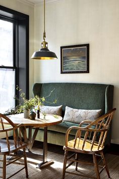 a living room with two chairs and a table in front of a window that reads west week's links - house of jade interiors blog