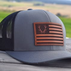 Red, white and bull is designed for the American elk hunter. Top quality Pacific Headwear 104C mesh-back hat is the ultimate in comfort with 100% leather patch detailing stamped and stitched right here in the great pacific northwest. Palouse Prairie snap-back hats make a perfect gift for those hard-to-buy for on your list. They are loved by men and women alike for their comfort, quality, and simple style. Great for birthdays, Valentine's day, father's day and graduation gifts. Feel free to messa Christmas Gift For Husband, Mens Dress Hats, Outdoorsman Gifts, Country Hats, Bull Elk, Hat Wall, Farm Clothes, Southern Outfits, Hunting Hat