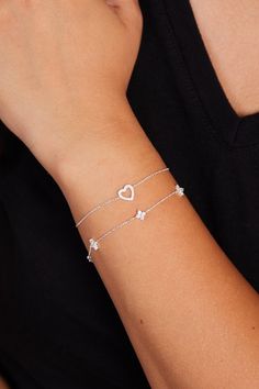 Show your love with the Sterling Silver Heart Bracelet, a beautifully crafted, minimalist piece that exudes elegance and charm. Perfect as a gift for her, whether it's for a girlfriend, a close friend, or a loved one, this bracelet features a delicate heart charm that symbolizes affection and connection. Its sleek sterling silver chain and dainty flower accents make it an ideal accessory for everyday wear or special occasions. This bracelet is the perfect balance of subtlety and sophistication, making it a meaningful gift that will be cherished for years to come. Finding the perfect fit is a breeze! Our bracelets are designed to be adjustable approx. 1 inches, so everyone can feel comfy and confident. For example: if you order 6 inches, you will be able to use your braceelt up to 7 inches. Dainty Silver Bracelets, Heart Bracelets, Silver Heart Bracelet, Bracelet Heart, Bracelet Minimalist, Dainty Bracelet, Bracelet Dainty, Wedding Jewelry Bracelets, Dainty Bracelets