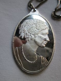 Beautiful vintage 999 sterling silver Suisse Cameo Lady pendant necklace needs cleaned in good condition and measures 2 inches with a 18 inch sterling box chain. Formal Oval Sterling Silver Cameo Jewelry, Antique Silver Nickel-free Pendant Necklace, Silver Cameo Medallion Necklace, Luxury Silver Cameo Necklace, Oval Silver Cameo Brooch, Cuyahoga Falls, Box Chain, Fine Silver, Pendant Necklaces