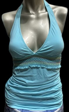 Stretch Blue Swim Dress For Pool, Fitted Halter Neck Tankini For Poolside, Blue Ruched Swim Dress For Beachwear, Beachy Fitted Halter Neck Tankini, Summer Ruched Halter Top For Beach, Fitted Blue Swim Dress For Pool, Halter Top For Swimming Vacation, Fitted Ruched Tankini For Beach, Fitted One-piece Halter Top For Poolside