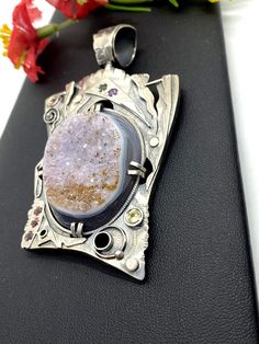 "Artisan Gemstone Druzy Pendant Hand-made Sterling Silver. Stones used: Brazilian Druzy, Pink Tourmaline, Yellow Sapphire, Citrine, Mystic Topaz. Height - 76mm, Width - 46mm. Unique Handcrafted One-of a-kind Design Pendant Each Piece of Jewelry in my Collection is Absolutely One of a Kind! When you start wearing a piece of my jewelry you will fall in love with it more and more each day and feel that good Energy and Love that I pass into it while creating this piece of Art. A piece of Art created Silver Fusion Jewelry With Stones, Fusion Style Silver Jewelry With Stones, Artisan Jewelry With Rectangular Pendant For Gift, Fusion Style Oval Jewelry With Stone Setting, Oval Fusion Jewelry With Stone Setting, Artisan Silver Necklace For Gift, Fusion Style Sterling Silver Jewelry With Stone Setting, Artisan Sterling Silver Pendant Necklace, Artisan Jewelry With Stones As A Gift