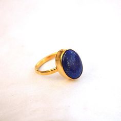 Lapis Lazuli Yellow Gold Ring-9K,14K,18K,22K Solid Gold Rings-January Birthstone Gold Ring -Gold Wedding Ring -Yellow Gold Ring- Lapis Ring Available in 9K,14k,18K,22K yellow solid gold bezel and solid yellow gold ring are both shined to an extremely high polish. But if you prefer it in matte convo me after purchasing. The main stone is natural Lapis Lazuli Gemstone. The pictures have been enlarged to show the details. The band is about 2 mm wide and 1 mm thick. This ring is made to order in you Classic Gold Stackable Rings With Gemstones, Gold Crystal Gemstone Ring For Promise, Gold Crystal Gemstone Promise Ring, Gold Crystal Promise Ring With Gemstone, Classic Gold Birthstone Ring With Gemstone, Gold Crystal Ring With Gemstone In 14k Gold, Gold Rings With Gemstone For Fine Jewelry, 14k Gold Crystal Ring With Gemstone, Gold Gemstone Stackable Rings For Wedding