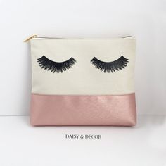 Our hand drawn eyelashes now come on cosmetic bags! This makeup bag is the best addition to your collection! It is big enough for all of your makeup pallets and fits so much makeup, jewelry, and the list goes on!Eyelashes Printed on One SideMeasurements: 9.75 x 8 x 1.5"Material: Cotton Canvas and faux leatherlined inside. Lining is cream color. Makeup and jewelry shown not included©Daisy and Decor. Rose Makeup, Makeup Pallets, Color Makeup, Large Clutch, Godmother Gifts, Pouch Organizer, Jewelry Show, Decor Canvas, Makeup Pouch