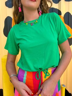 Wear your joy with the Joyful Green Drawstring top! You will love this top for its effortless style, drawstring bottom that gives you flexibility on how you style it, and of course the fun Kelly green color! This top is roomy for its size so we recommend sizing down if between sizes and if you want a more snug fit. Adjustable drawstring Fun Kelly Green color Breezy fit to beat the summer heat Slightly cropped so it is great with high-waisted bottoms True to size 92% Polyester 8% spandex Kate is