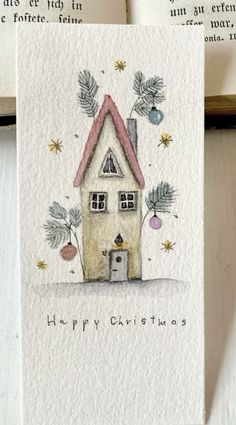 a christmas card with a house on it