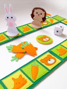 the game board has animals and carrots on it