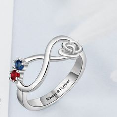 Personalized Infinity Promise Ring For Women has an infinity shape in the center along with two hearts knotted each other in a way symbolizing promise, making it a perfect promise ring for women. It also has two birth stones on it and a personalized message can be engraved inside the ring. Features: Color: Silver Material: Silver Style: Personalized Size: Available Size: US - 5/6/7/8/9 Weight: 2g Size Chart: Size Circumference(mm) UK,Europe & Australia CN/SG/JP Switzerland 5 49.3 J 1/2 9 9 6 51. Adjustable Infinity Promise Ring, Mother's Day Infinity Adjustable Rings, Adjustable Infinity Ring For Mother's Day, Infinity Promise Rings For Mother's Day, Infinity Promise Ring For Valentine's Day, Adjustable Ring For Anniversary Gift On Mother's Day, Infinity Rings As Gifts For Mother's Day, Infinity Rings For Mother's Day Gift, Personalized Adjustable Infinity Rings