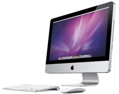 an apple desktop computer sitting next to a keyboard and mouse