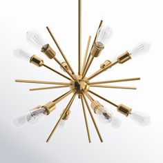 a brass chandelier with six lights and five bulbs hanging from the center, on a white background