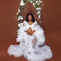 Instagram : Oyemwen White Gown With Long Train For Party, White Ruffled Maxi Dress For Wedding, White Tulle Gown With Long Train, White Floor-length Ruffled Wedding Dress, White Floor-length Maternity Maxi Dress, White Maternity Dress With Ruffles, White Ruffled Gown For Wedding Night, Maternity Maxi Dress With Ruffles For Wedding, White Maxi Maternity Dress For Wedding