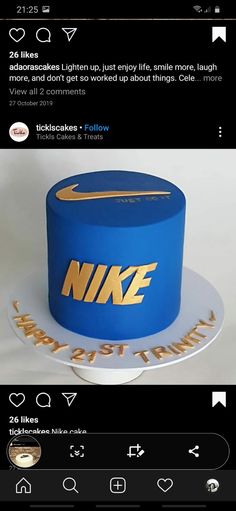 a blue nike cake with gold lettering on it