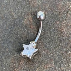 Star Belly Button Navel Ring. Crystal Star At Bottom End. Top Ball Closure Has A Crystal In It Too. Surgical Steel. 14 G. New Without Tags, Never Used. Penny For Scale. Navel Jewelry Unique, Star Belly Button Ring, Belly Button Rings Silver, Adjustable Silver Star Belly Ring, Star Belly Button Piercing, Bellybutton Ring, Belly Piercings, Belly Button Piercing Jewelry, Belly Piercing Jewelry