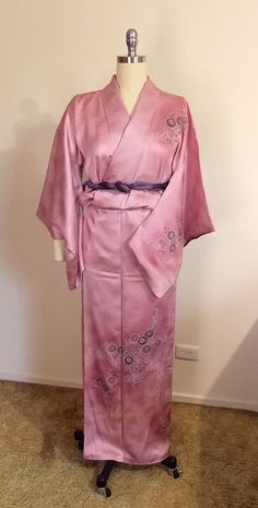 Gorgeous and lovely SAKURA pink silk semi formal TSUKESAGE KIMONO. It's so sweet and elegant. Suitable for a party, tea ceremony, robe or any relaxing Well hand sewing made. Age-2000~ Conditions- Excellent, the KAKE-ERI top ray collar has been removed. Slight stains - not noticed -on the front ( be hidden with OBI) and left sleeve bottom, pin-dot stain on the front. Material-silk figured crepe satin, chrysanthemum paint with embroidery partly. Lining-silk Size- Small *Please refer to finished me Formal Spring Kimono With Kimono Sleeves, Elegant Kimono With Kimono Sleeves For Tea Ceremony, Elegant Long Kimono For Tea Ceremony, Formal Satin Kimono With Kimono Sleeves, Formal Satin Kimono, Pink Kimono With Kimono Sleeves For Tea Ceremony, Pink Kimono For Tea Ceremony, Traditional Pink Silk Kimono, Pink Silk Kimono For Wedding