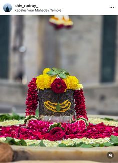 a cake decorated with flowers on top of a table