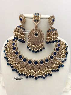 Antique Gold Polki Necklace Set comes with Jhumki earrings and tikka / Indian Jewelry/ High Quality Kundan and Polki Jewelry/ Bollywood Jewelry/Wedding/Navy blue  All items are shipped from Brampton, Ontario, Canada. If you need your item by a certain day, please reach out to us for express delivery option before placing the order so that we can update the shipping for you. Standard shipping/delivery timeline Below are the delivery timeline estimates once the order ia shipped ---> USA delivery t Blue Bridal Jewelry Indian, Blue Jewelry Indian, Bollywood Blue Bridal Necklace Hand Set, Festive Blue Kundan Necklace With Intricate Design, Blue Kundan Necklace With Intricate Design For Festive Occasions, Blue Kundan Necklace For Celebration, Festive Blue Kundan Bridal Necklace, Blue Kundan Necklace For Diwali Wedding, Blue Kundan Necklace For Wedding And Diwali