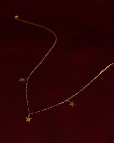 Made in 18K gold over brass Adjustable chain length: 16 to 18 inches; 40 + 2.5 + 2.5 cms Star charm height: 8 mm 14k Gold Star Charm Necklace, 14k Gold Necklace With Star Charm, Gold Star Necklace With Delicate Chain, Celestial Gold Star Of David Necklaces, Celestial Gold Star Of David Necklace, Minimalist Star-shaped Tarnish-resistant Necklace, 14k Gold Star Charm Pendant Necklace, 14k Gold Pendant Necklace With Star Charm, 14k Gold Star Charm Necklaces