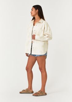 An embroidered cotton shirt jacket with a snap button front. Embroidered Relaxed fit Long sleeves Button wrist closure Collared neckline Snap button front Front patch pockets Lightweight shirt jacket Delicate embroidered floral details add a bohemian touch to this cool, lightweight spring shirt jacket. With long sleeves, a classic collared neckline, and a snap button front. The perfectly relaxed fit layers well over a simple tee or a light sweater. Model is 5'9, wearing a size S.Style: I-20289W-SPC Spring Cotton Shacket With Buttons, Spring Cotton Shacket With Snap Buttons, Spring Cotton Outerwear With Camp Collar, White Relaxed Fit Cotton Shacket, White Cotton Shacket With Relaxed Fit, Oversized Embroidered Cotton Outerwear, Spring Outerwear With Button Closure And Camp Collar, Spring Outerwear With Camp Collar And Button Closure, Cotton Outerwear With Button Closure And Camp Collar