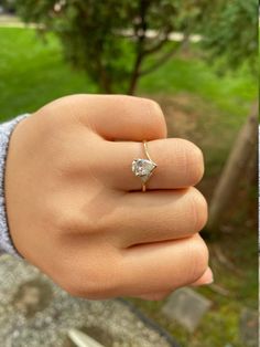 a woman's hand with a diamond ring on it and another photo of her finger