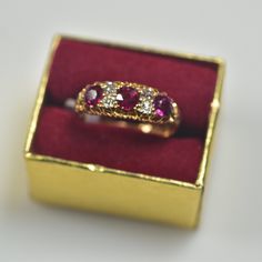 British hallmarks, natural mine cut vivid red rubies, old mine cut diamonds. 18 karat assay mark British Sheffield hallmark (Crown) T hallmark age 1787 1.0 carats total weight of fine natural rubies .20 carats of natural old mine cut diamonds Some normal wear for the age of the ring, sold as is Classic Red Diamond Ring With Single Cut Diamonds, Classic Red Ruby Ring With Single Cut Diamonds, Antique Ruby Ring With Single Cut Diamonds, Red Ruby Ring With Single Cut Diamonds, Red Diamond Ring With Single Cut Diamonds, Pink Ruby Ring With Single Cut Diamonds, Red Victorian Diamond Ring, Red Diamond Ring With Single Cut Diamonds For Anniversary, Heirloom Red Diamond Rings With Single Cut