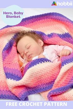 a baby sleeping on top of a pink and purple blanket