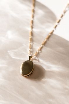 Our take on the classic locket necklace. Our Oval Locket Necklace is lightweight and great for layering! You can store two photos in the locket - whether it's your significant other, mom, dog, etc. - whatever is special to you! You won't want to take it off - and you won't have to! Find more at Simple & Dainty! Vintage Charm Oval Link Necklace As Gift, Oval Link Necklaces With Vintage Charm For Gifts, Oval Locket Necklace With Vintage Charm For Keepsake, Vintage Charm Oval Locket Necklace Keepsake, Keepsake Locket Necklace With Vintage Charm And Oval Pendant, Dainty Everyday Locket Necklace, Dainty Oval Personalized Locket Necklace, Dainty Personalized Oval Locket Necklace, Classic Oval Link Locket Necklace