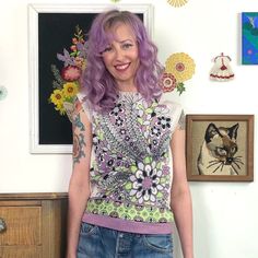 Vintage Flower Print Top, 1960s Lavender & Green Shirt, Sz S-M.  This is a super groovy top from the 1960s.  Double knit polyester top has a fantastic groovy flower power print with Brady Bunch vibes.  Super stretchy fabric and the design is vibrant and fun.  A pastel pink-purple color is mixed with bright lime green and black against a white background. Boxy cut with a zipper at the back of the neck (I forgot to zip it when I modeled this but the zipper does work). No tags. Measures like a modern small or fitted medium. Bust 35"-40", waist 34"-38", across shoulders 14.5", and 22" shoulder to hem. Vintage Purple Top For Spring, Vintage Pink Tops With Retro Print, Pink Vintage Tops With Retro Print, Purple Retro Spring Tops, Spring Vintage Tops With Retro Print, Vintage Retro Print Tops For Spring, Vintage Multicolor Tops For Spring, 1970s Style Tops For Spring, Vintage Purple Graphic Print Top