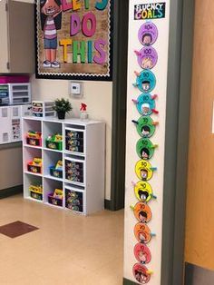 this classroom is decorated with colorful posters and bookshelves for the children to read