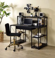 a computer desk with a laptop on it in front of a plant and bookshelf