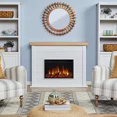 a living room filled with furniture and a fire place in the middle of the room