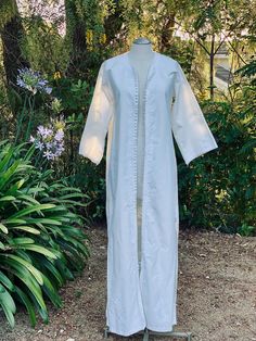 Bohemian minimalist white morrocan wedding dress for the perfectly simple beach wedding. There is a pretty white threaded embroidery to line the hand buttoned front of the dress. Where it as a dress or even as a robe.  Measurements laying flat across: Pit to pit- 20" Waist- 20" Hips- 21" Length- 56.5" Sleeve- 22" Elegant Cotton Dress For Wedding Night, Elegant Cotton Beach Kaftan, White Fitted Cotton Kaftan, Elegant Cotton Kaftan For The Beach, Elegant Cotton Kaftan For Spring, White Chikankari Embroidery Kaftan For Wedding, Elegant Spring Kaftan With Chikankari Embroidery, Elegant Spring Wedding Kaftan, Elegant White Fitted Kaftan