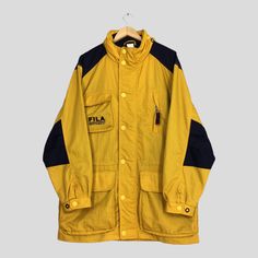 Vintage 90s Fila Sport Bomber Parka Jacket XLarge Fila Ski Wear Snowboarding Yellow Jacket Fila Winter Snow Gear Ski Suit Hoodie Coat XL Please contact me for any questions about this clothing before buying. Size on tag : None but fits like Size XL (check measurements below) Measurement : Armpit to armpit : 26" inches Back collar to hem (total length) : 34" inches Weight : 1.01 kg Condition : Good Condition. No holes and no stains. Delivery / Postage :- DHL EXPRESS / EXPEDITED = 3-5 business day 90s Style Track Jacket With Pockets For Streetwear, Retro Long Sleeve Outerwear For Outdoor, Vintage Streetwear Parka With Pockets, Vintage Windbreaker With Pockets For Streetwear, Retro Long Sleeve Windbreaker For Winter, 90s Style Streetwear Outerwear With Pockets, 90s Style Outerwear With Pockets For Streetwear, Yellow Hooded Parka With Pockets, Yellow Hooded Casual Parka