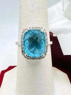 14K White Gold Blue Topaz & Diamond 0.35ct Ring Size 7.25 A perfect gift for your loved one for any special occasion or holiday! Total Ring Weight: 3.89g Ring Length: 28.26mm Ring Width: 20.18mm Gemstone: Diamond Total Diamond: 0.35ct Item will be placed into a gift box. * Diamond Topaz Ring With Vs Clarity For Gift, Diamond Topaz Ring With Vs Clarity As A Gift, Aquamarine Diamond Ring With Vvs Clarity As Gift, Vvs Clarity Aquamarine Diamond Ring As Gift, Aquamarine Diamond Ring With Diamond Accents For Gift, Aquamarine Diamond Ring With Accents For Gift, Aquamarine Diamond Ring With Accents As Gift, Turquoise Topaz Ring For Anniversary In Fine Jewelry Style, Fine Jewelry Turquoise Topaz Ring For Anniversary