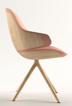 a chair with wooden legs and a pink seat