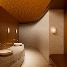 a bathroom with two sinks and wooden walls