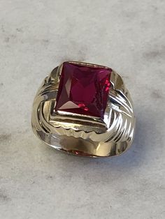 A Classic Mens 14kt Yellow Gold Mens Red Spinel Octagon Shape bezel set in fashion style ring. Finger size 8. total weight is 7.5 grams. This item would Retail for $895.00 Classic Red Signet Ring Stamped 14k, Heirloom Red Gold Signet Ring, Heirloom Red Diamond Cut Ring, Classic Red 14k Gold Signet Ring, Classic 14k Gold Red Signet Ring, Formal Red Rings With Bezel Setting, Formal Ruby Signet Ring With Bezel Setting, Formal Red Diamond Cut Ring, Ruby Signet Ring With Bezel Setting For Formal Occasions