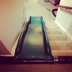 an escalator going down the stairs in a house with caption that reads, dear future me you better be the coolest parent out there and put a slide on the stairs