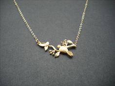 this beautiful necklace is made with matte 16K gold plated bird on a branch connecter hanging on a 16K gold plated chain gold plated chain and clasp can be upgrade to 14K gold filled metal. If you prefer 14K gold filled chain and clasp instead of gold plated one, please order this link with this item! Listing: http://www.etsy.com/listing/81879795/14k-gold-filled-chain thank you Gold Jewelry With Bird Design For Wedding, Elegant Gold Jewelry With Bird Design, Gold Wedding Jewelry With Bird Design, Elegant Gold Necklace With Bird Design, Gold Pendant Necklace With Bird Design, March Birthstone Necklace, Aquamarine Necklace, Gold Gold, Butterfly Necklace