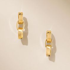 Discover effortless elegance with our Luna Link Earrings. Made from sterling silver and finished with 14K gold plating, these refined drops bring a touch of modern sophistication to any outfit. Versatile and chic, they are perfect for both daily wear and special moments. Product Details: Made from 14K gold plated .925 sterling silver Measures approximately 0.75" total length Post & Friction Triple Oval Link Drop Earring AL200130V Made in Italy Modern Yellow Gold Earrings With Elegant Design, Elegant 14k Gold Earrings With Shiny Finish, Modern Elegant Yellow Gold Earrings, Elegant Linear Earrings For Everyday, Elegant Everyday Linear Earrings, Elegant Linear Earrings, Luxury Gold Earrings For Everyday Elegance, Chic Linear Earrings For Formal Occasions, Elegant Gold-tone Earrings For Anniversary