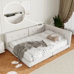 a white bed sitting on top of a hard wood floor