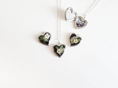 Capture memories with this exquisite real flower heart locket necklace, a perfect personalized gift keepsake. A beautiful way to cherish a special moment with a custom photo inside. Ideal for birthdays, anniversaries, or any meaningful occasion. Three design options available: Please see the photos for option 1, 2, and 3 and select the preferred one from the drop down menu.  Pendant is heart shaped that measures approximately .65" x .84" (17mm wide, 21.5mm long) The locket and chain are silver p Personalized Pendant Locket Necklace For Mom, Personalized Pendant Locket Necklace Gift For Mom, Valentine's Day Gift Locket Necklace For Mom, Mother's Day Heart Charm Locket Necklace Gift For Mom, Mother's Day Keepsake Locket Charm Necklace, Mother's Day Keepsake Heart Locket Necklace, Mother's Day Flower Charm Locket Necklace Gift, Locket Charm Necklace For Mother's Day, Locket Charm Necklace For Mother's Day Personalized Gift